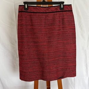 Classiques Entier knee length skirt. Textured red with black trim at waist